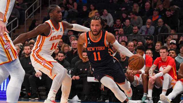 Knicks guard Jalen Brunson dribbles past Hawks forward AJ Griffin.